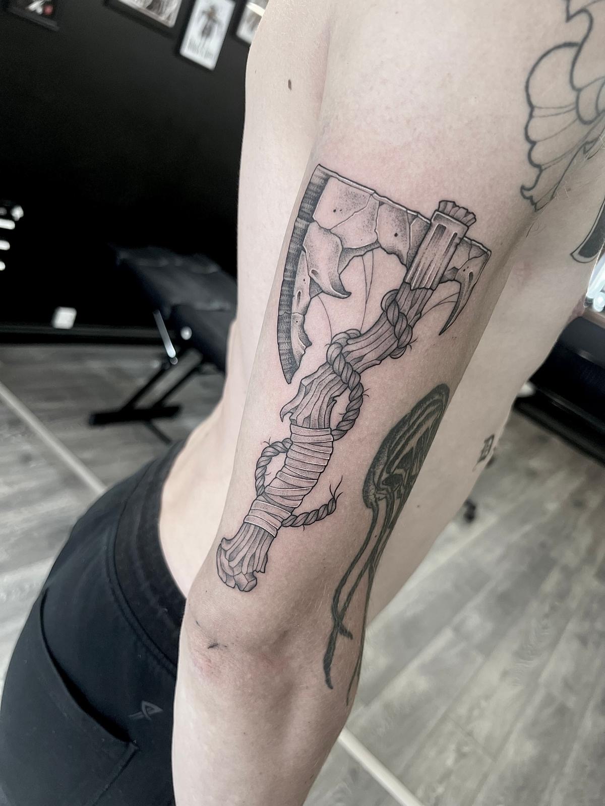 Nordic style axe tattoo