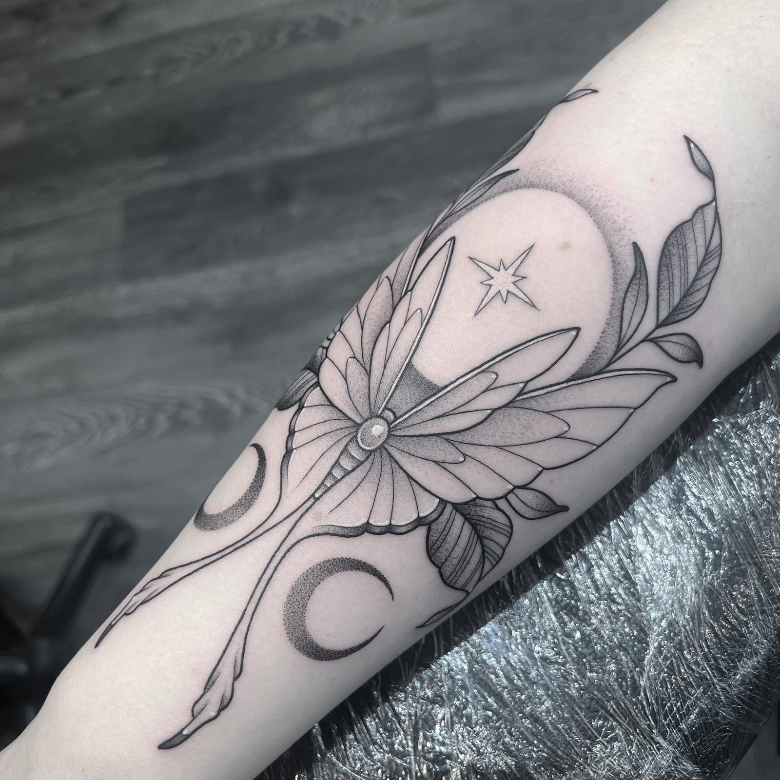 Lunar butterfly tattoo